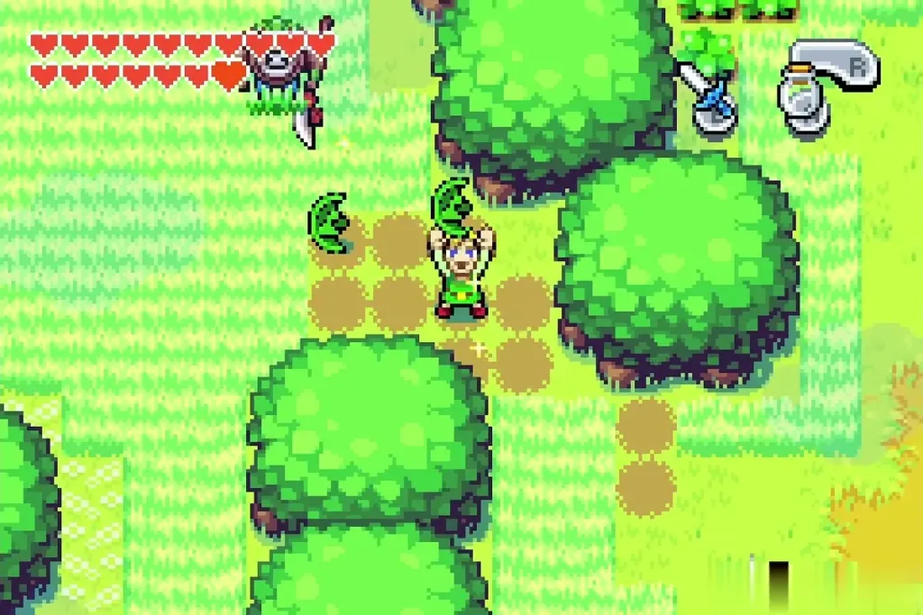 Link raising a green Kinstone piece in the cut grass of Western Wood