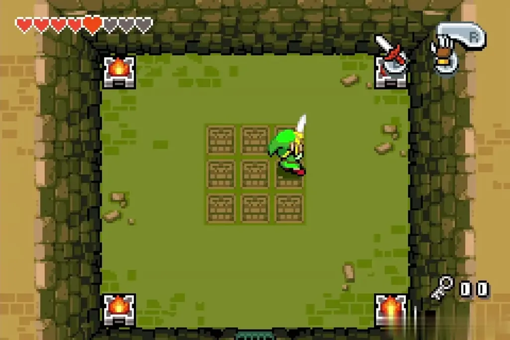Link with his sword raised in the arena with four flame statues Link with his sword raised in the arena with four flame statues