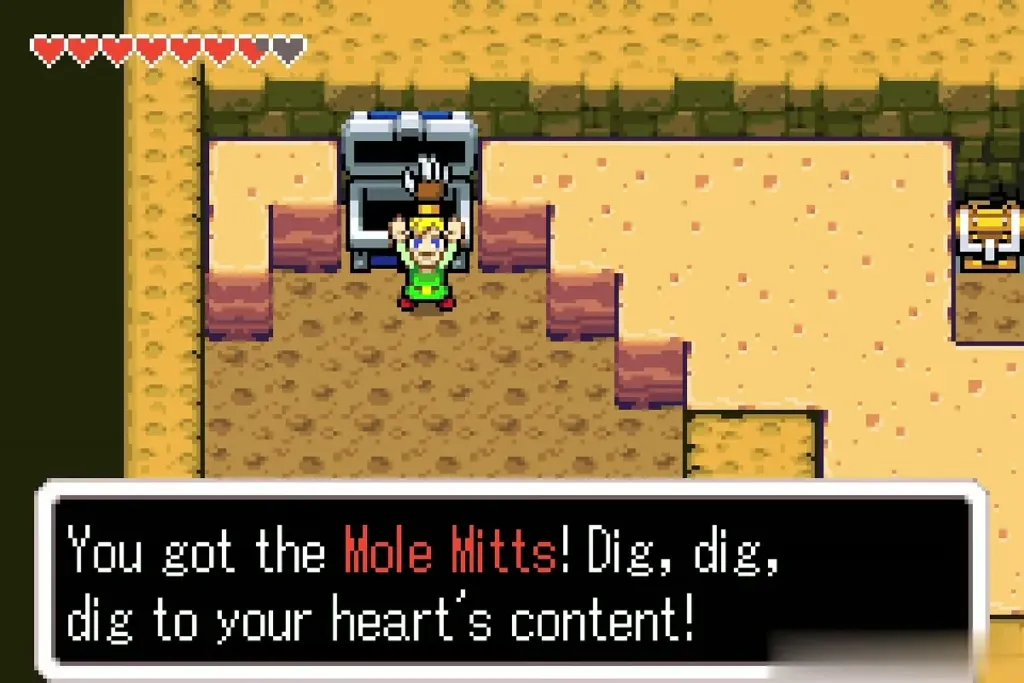 Link holding up the Mole Mitts with the You got the Mole Mitts message Link holding up the Mole Mitts with the You got the Mole Mitts message