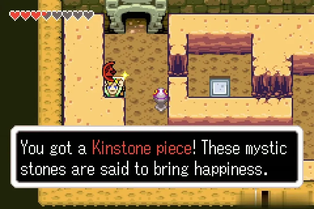 Link holding a red Kinstone piece with its message box Link holding a red Kinstone piece with its message box