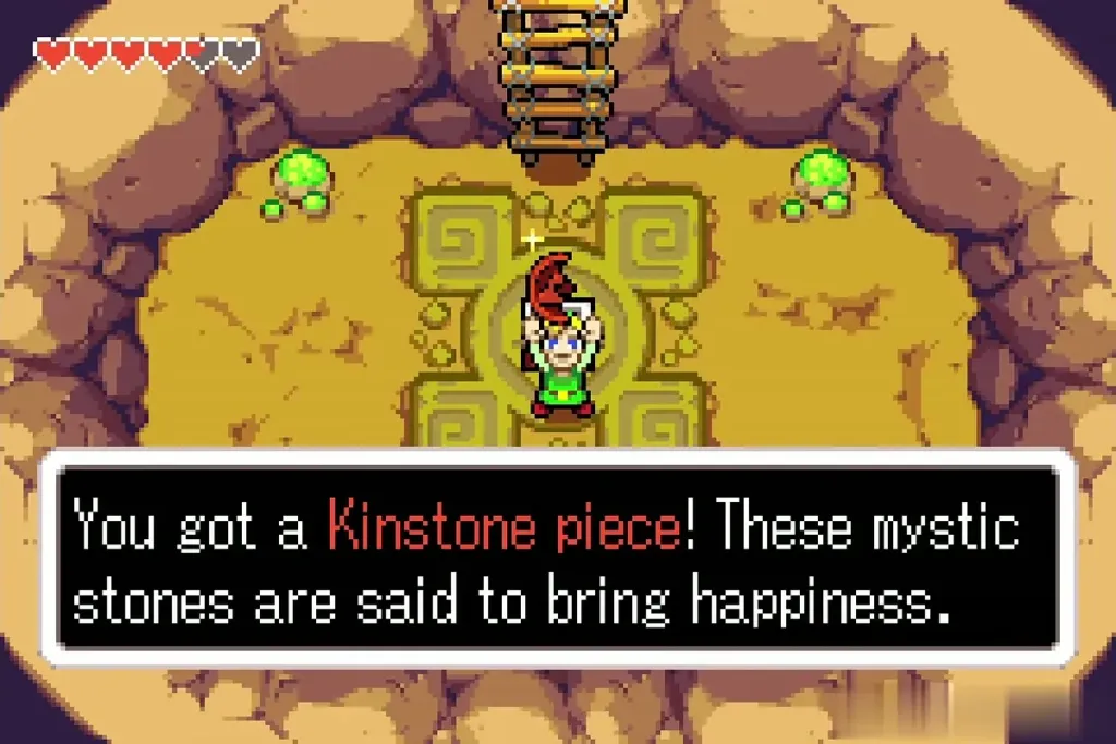 Link holding up a Kinstone piece in the round cave