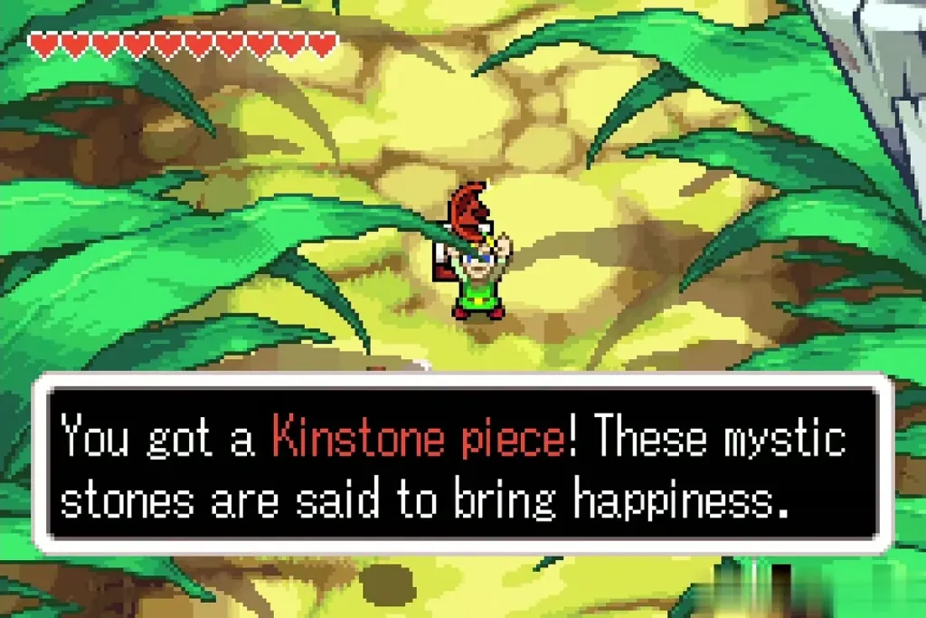 Link holding up a red Kinstone piece with the full message box Link holding up a red Kinstone piece with the full message box