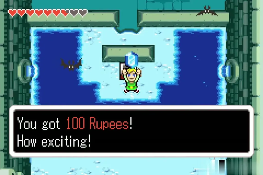 Link holding up a blue rupee with the 100 Rupees message shown in the icy pool room Link holding up a blue rupee with the 100 Rupees message shown in the icy pool room