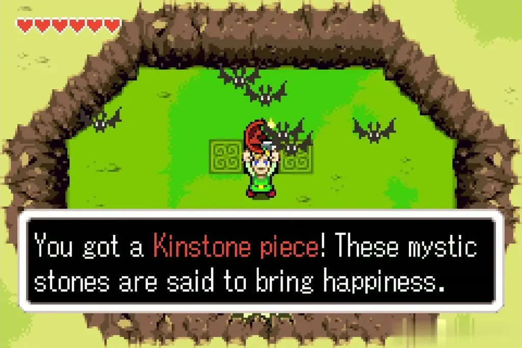 Link holding up a red Kinstone piece with the full item message Link holding up a red Kinstone piece with the full item message