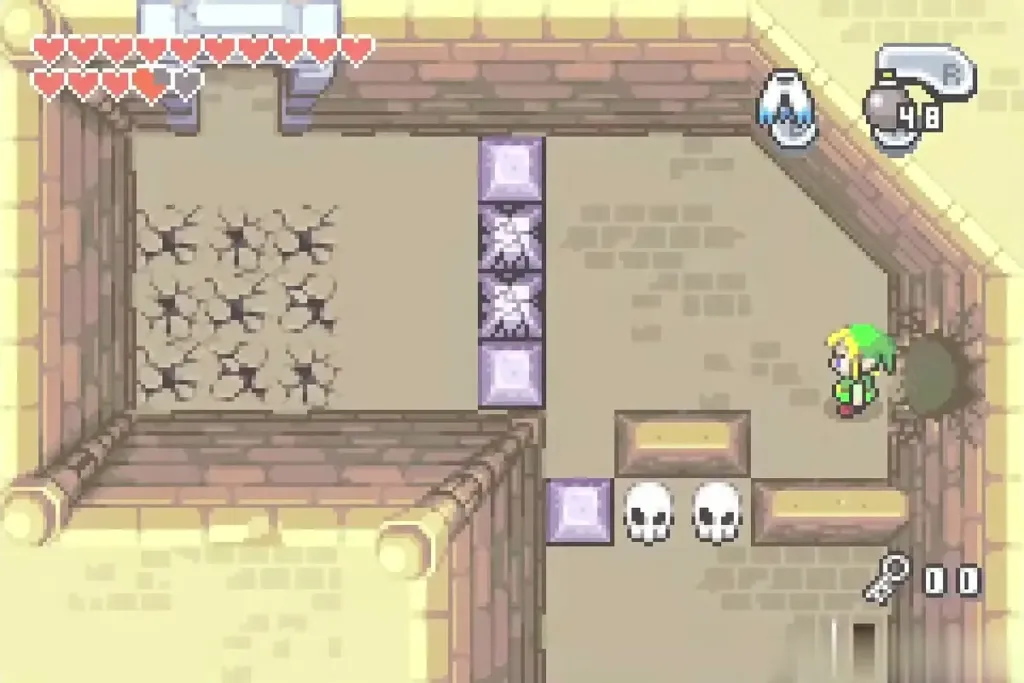 Link beside a hole in a Palace of Winds room with cracked floor and blocks Link beside a hole in a Palace of Winds room with cracked floor and blocks