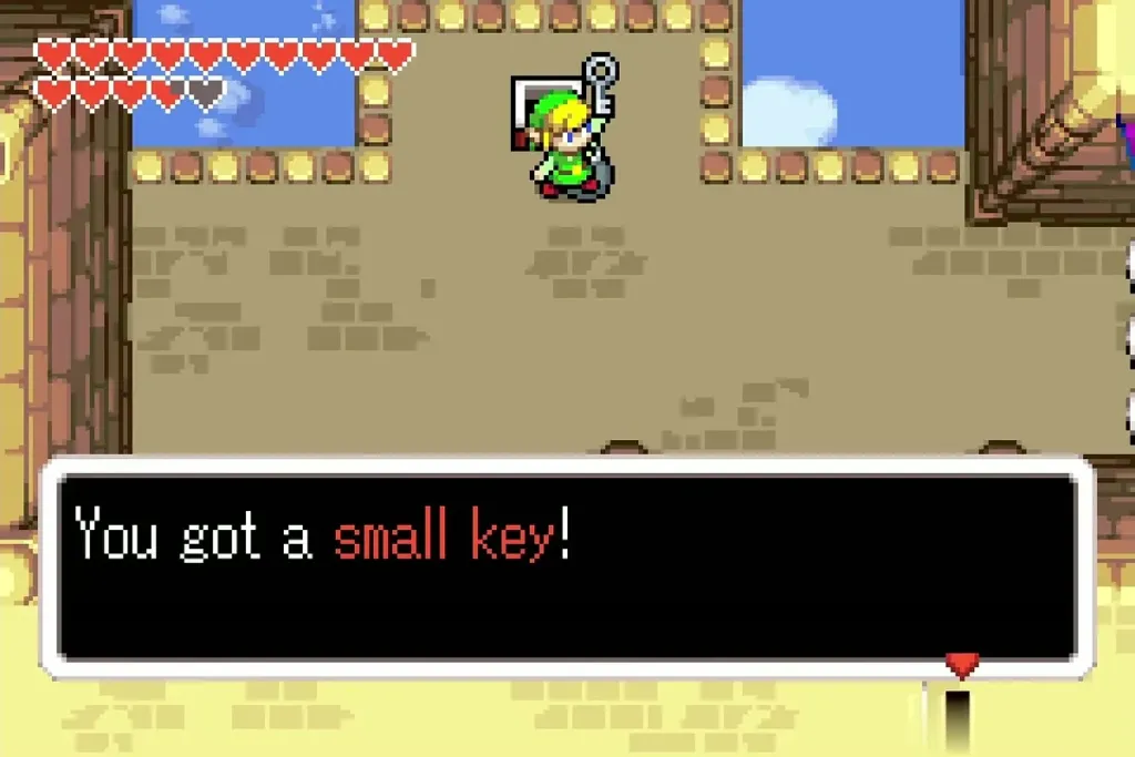 Link holding up a small key with its message fully shown Link holding up a small key with its message fully shown