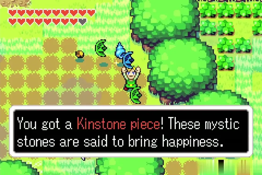 Link holding up a Kinstone piece, full item message shown Link holding up a Kinstone piece, full item message shown