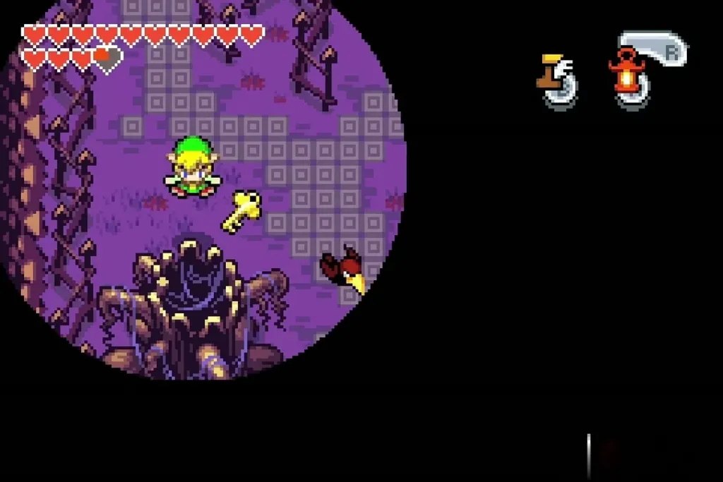 The graveyard key lying on the ground beside Link while the crow flies off