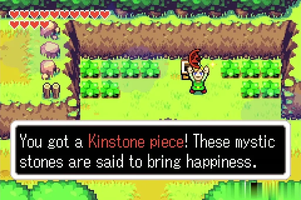 Link holding up a red Kinstone piece with the item message shown