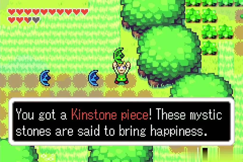 Link holding up another Kinstone piece with blue pieces on the path