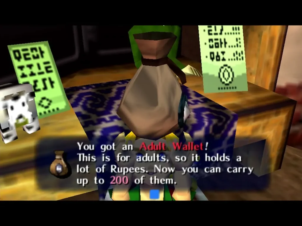 Link holds up the Adult Wallet in the Bank, the box saying it holds a lot of Rupees, up to 200 Link holds up the Adult Wallet in the Bank, the box saying it holds a lot of Rupees, up to 200
