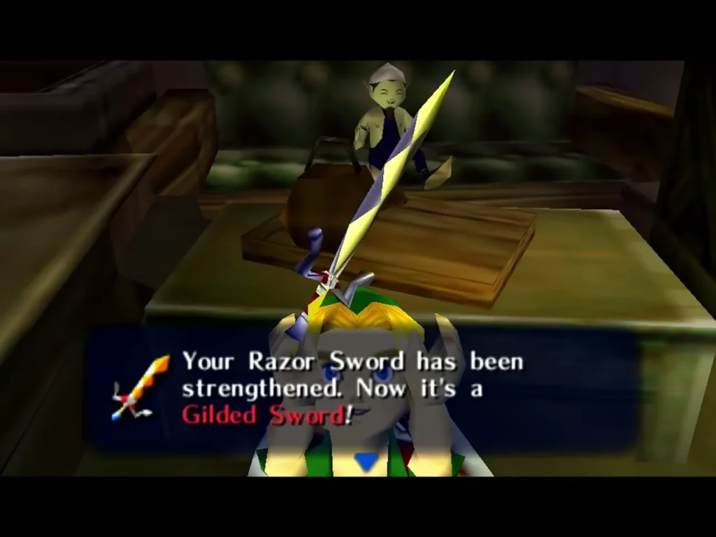 Link holds up the Gilded Sword at the smithy, the box saying his Razor Sword has been strengthened Link holds up the Gilded Sword at the smithy, the box saying his Razor Sword has been strengthened