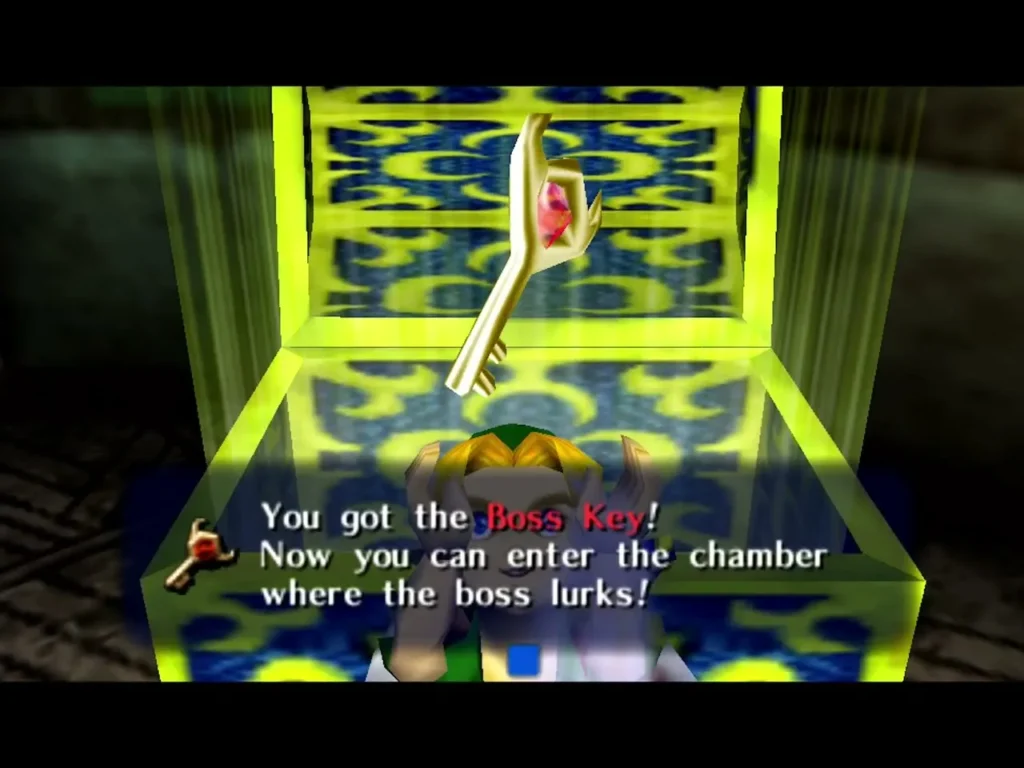 Link holds up the Boss Key from a glowing chest, the box saying he can now enter the chamber where the boss lurks Link holds up the Boss Key from a glowing chest, the box saying he can now enter the chamber where the boss lurks