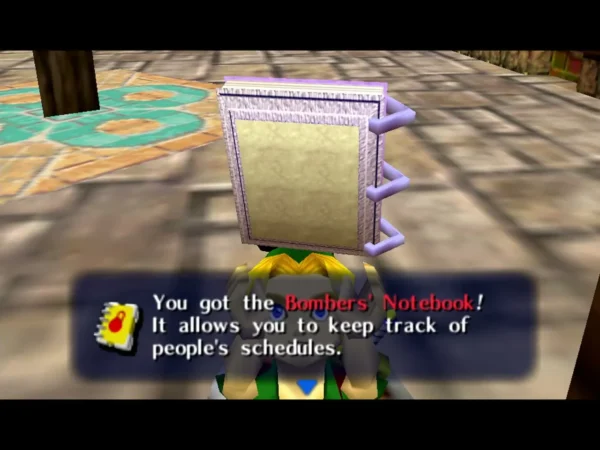 Link holds up the Bombers' Notebook under the box that says 'You got the Bombers' Notebook!' Link holds up the Bombers' Notebook under the box that says 'You got the Bombers' Notebook!'