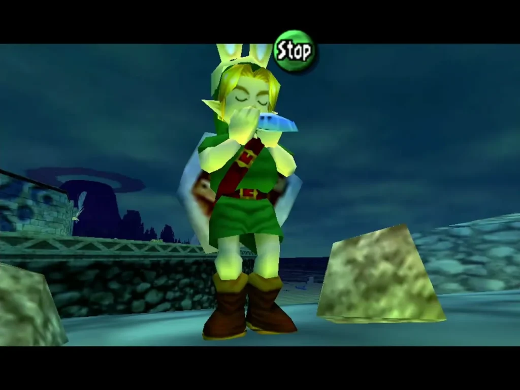 Link plays the ocarina on the night shore with the Stop prompt on screen Link plays the ocarina on the night shore with the Stop prompt on screen