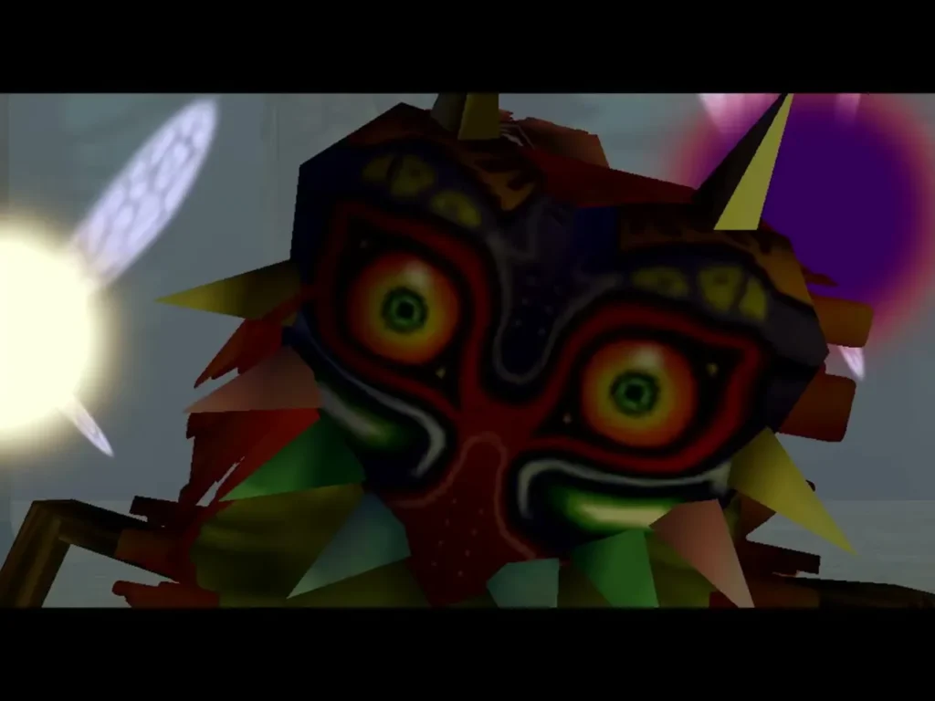 Close-up of Majora's Mask with glowing red and green eyes beside a fairy Close-up of Majora's Mask with glowing red and green eyes beside a fairy