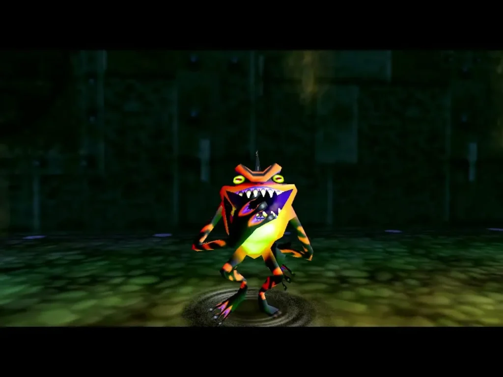 Gekko, a toothy orange and green frog-like creature, stands in a ripple on the Great Bay Temple floor Gekko, a toothy orange and green frog-like creature, stands in a ripple on the Great Bay Temple floor