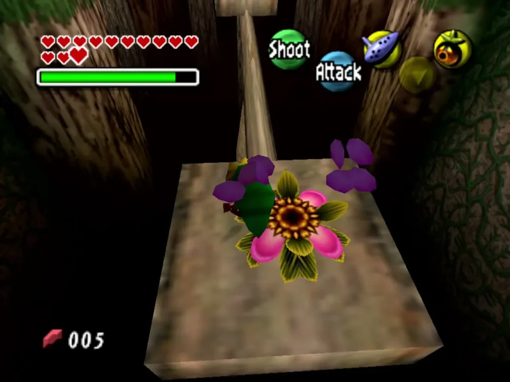 Deku Link lands on a pink flower on a wooden platform inside the Deku trial Deku Link lands on a pink flower on a wooden platform inside the Deku trial