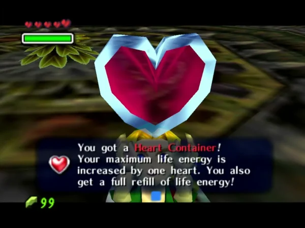 Link holding up a Heart Container, the message saying his maximum life energy is increased by one heart Link holding up a Heart Container, the message saying his maximum life energy is increased by one heart