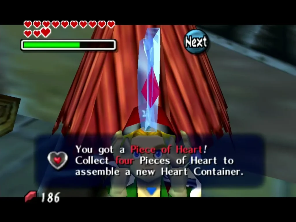 Link holds up a Piece of Heart after depositing mail, with its full message box Link holds up a Piece of Heart after depositing mail, with its full message box