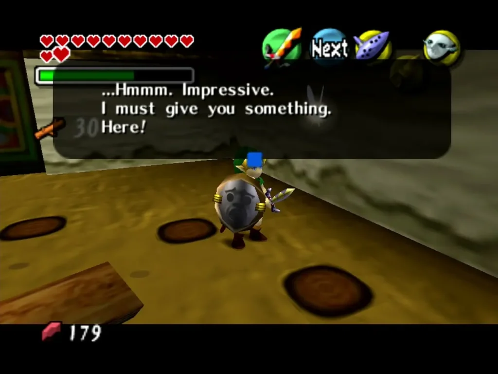 Link on the Swordsman School course, the message box reading Hmmm. Impressive. I must give you something Link on the Swordsman School course, the message box reading Hmmm. Impressive. I must give you something