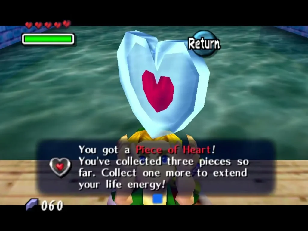 Link holding up a Piece of Heart after the Town Shooting Gallery, the box saying he has three pieces Link holding up a Piece of Heart after the Town Shooting Gallery, the box saying he has three pieces