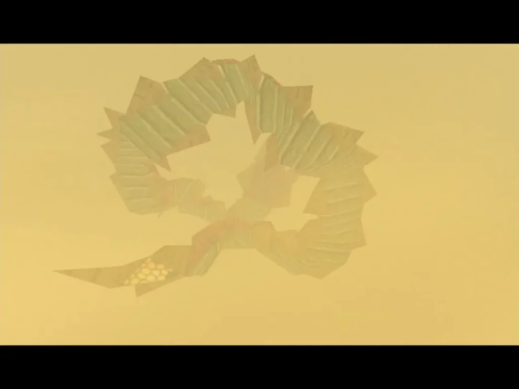 Twinmold's sand-colored body curls into a ring in the sandstorm Twinmold's sand-colored body curls into a ring in the sandstorm