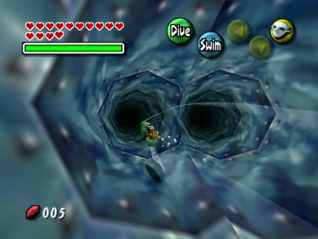 Zora Link swims through a forked blue pipe in the Zora trial maze Zora Link swims through a forked blue pipe in the Zora trial maze