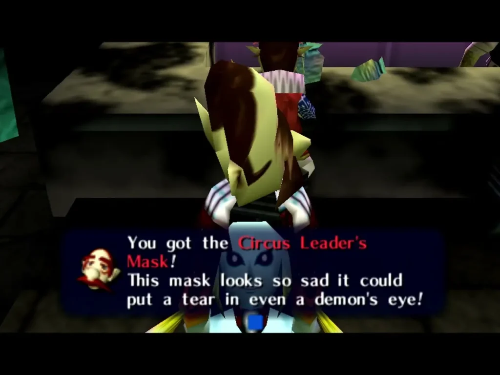 Link holds up the Circus Leader's Mask, the box reading This mask looks so sad it could put a tear in even a demon's eye