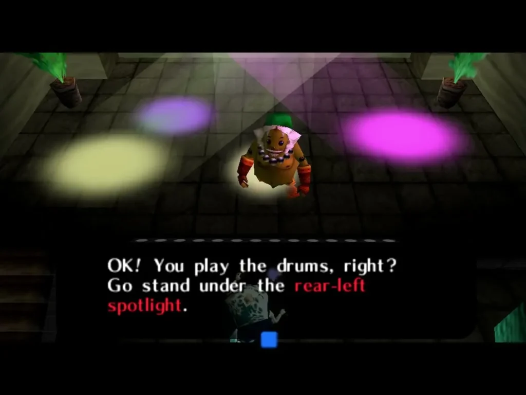 Link as a Goron on the Clock Town stage, the message reading Go stand under the rear-left spotlight