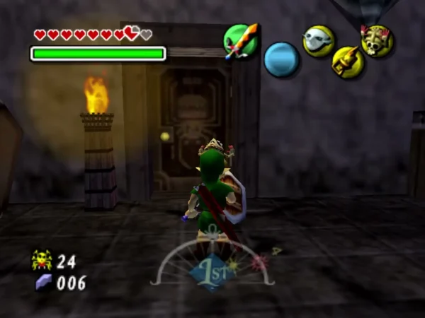 Link in the storage room beside a torch burning on a wooden barrel, next to a carved door Link in the storage room beside a torch burning on a wooden barrel, next to a carved door