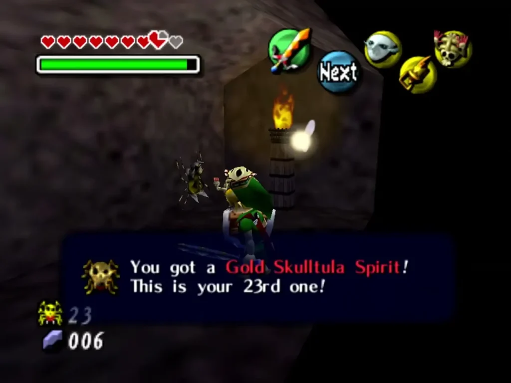 Link by the torch in the storage room with the twenty-third Gold Skulltula Spirit, the box reading This is your 23rd one Link by the torch in the storage room with the twenty-third Gold Skulltula Spirit, the box reading This is your 23rd one