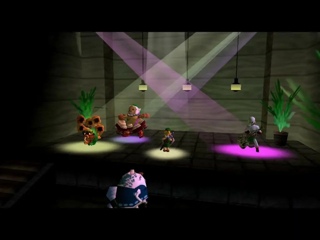 Link on the Latte stage with a Deku, a Goron and a Zora in the spotlights Link on the Latte stage with a Deku, a Goron and a Zora in the spotlights