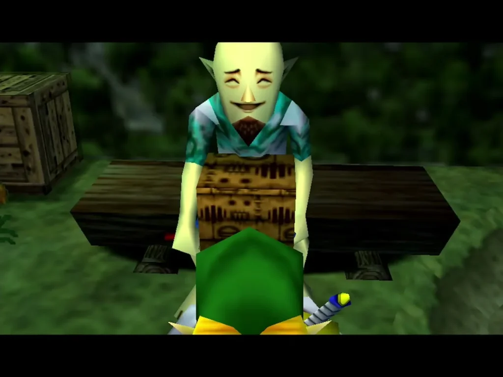 Bald smiling man in a teal shirt at a wooden table, facing Link at the Laundry Pool Bald smiling man in a teal shirt at a wooden table, facing Link at the Laundry Pool
