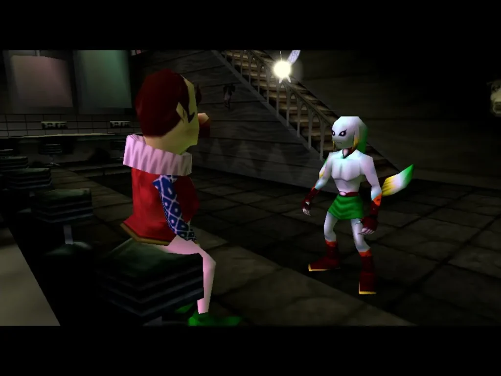 Zora Link standing at the Latte Milk Bar beside a seated performer in a red coat Zora Link standing at the Latte Milk Bar beside a seated performer in a red coat