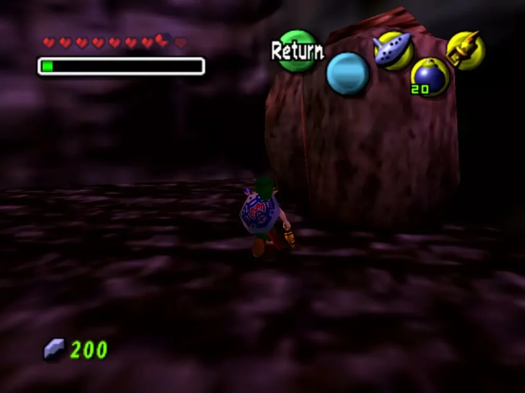 Link stands before a large boulder in a rocky passage with bombs equipped Link stands before a large boulder in a rocky passage with bombs equipped