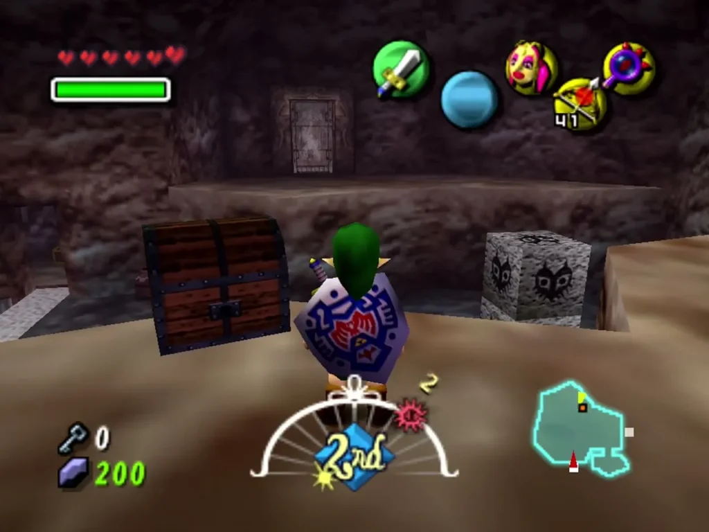 Link on a sandy ledge beside a closed chest and a carved mask block Link on a sandy ledge beside a closed chest and a carved mask block