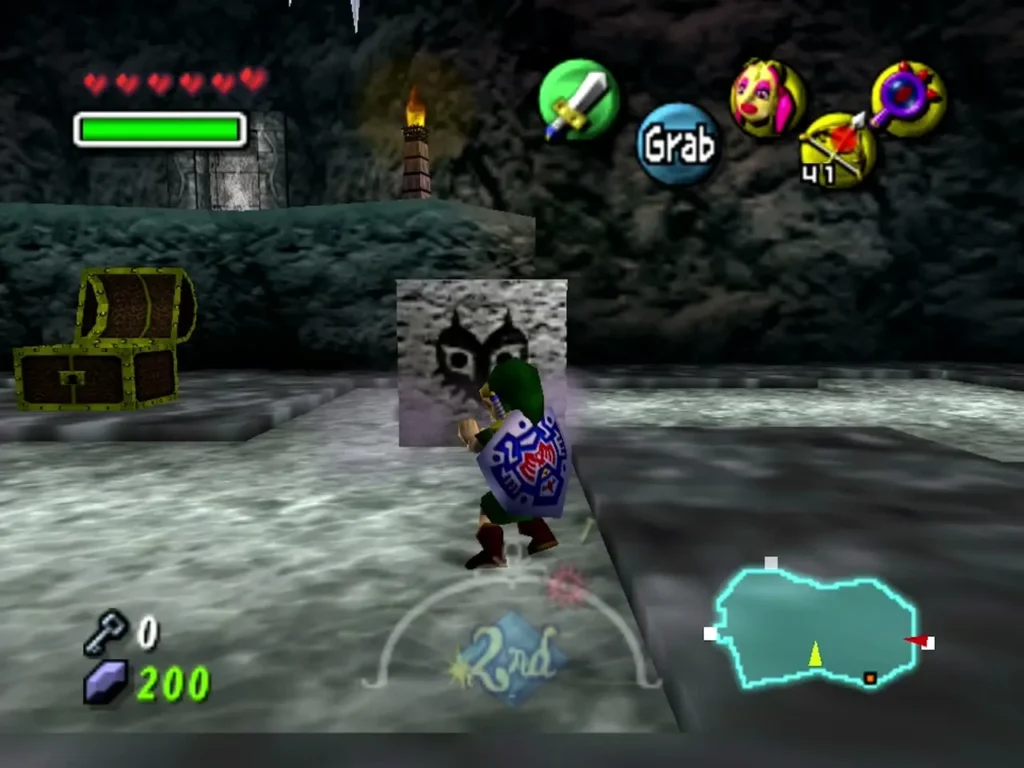 Link grabs a carved mask block below a ledge with a chest and a lit torch Link grabs a carved mask block below a ledge with a chest and a lit torch
