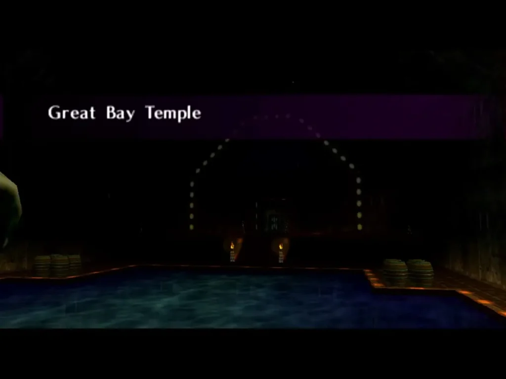 Great Bay Temple entrance room with torches and a blue pool, location name shown Great Bay Temple entrance room with torches and a blue pool, location name shown