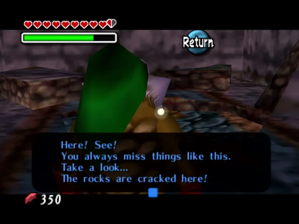 Tatl points out the cracked rocks, the box reading Here! See! You always miss things like this Tatl points out the cracked rocks, the box reading Here! See! You always miss things like this