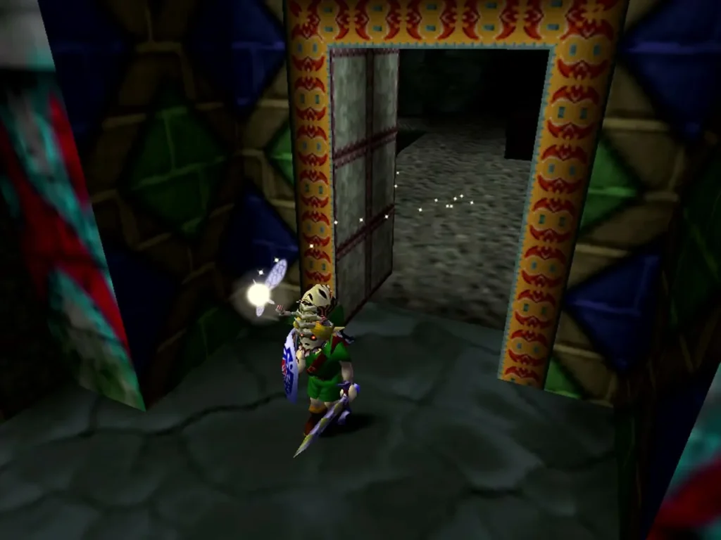 Link stands at the open crypt door with a fairy glowing beside him Link stands at the open crypt door with a fairy glowing beside him