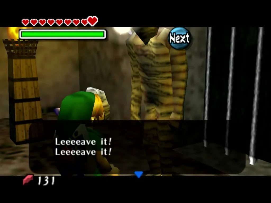 A Gibdo guarding a barred door tells Link in a raspy voice to leave it A Gibdo guarding a barred door tells Link in a raspy voice to leave it
