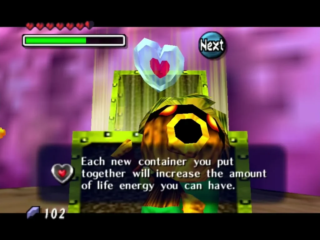 A Piece of Heart rises above the opened chest in Woodfall, with a message box about how heart containers raise life energy