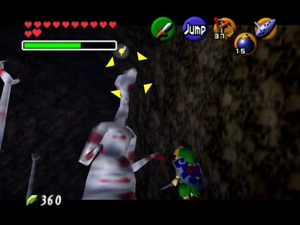 Link facing Dead Hand as its long pale arms swipe through the room