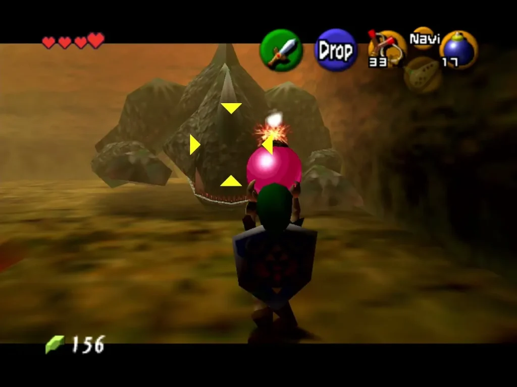 Link holding a bomb in front of King Dodongo's open mouth