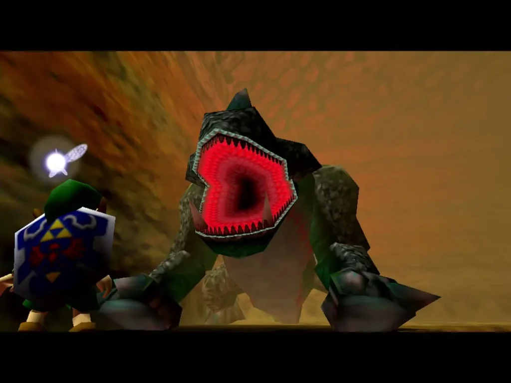 King Dodongo opening its red mouth as Link approaches in the cavern