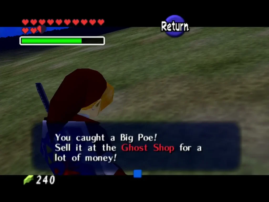 Link in a grassy field reading the box that says he caught a Big Poe Link in a grassy field reading the box that says he caught a Big Poe