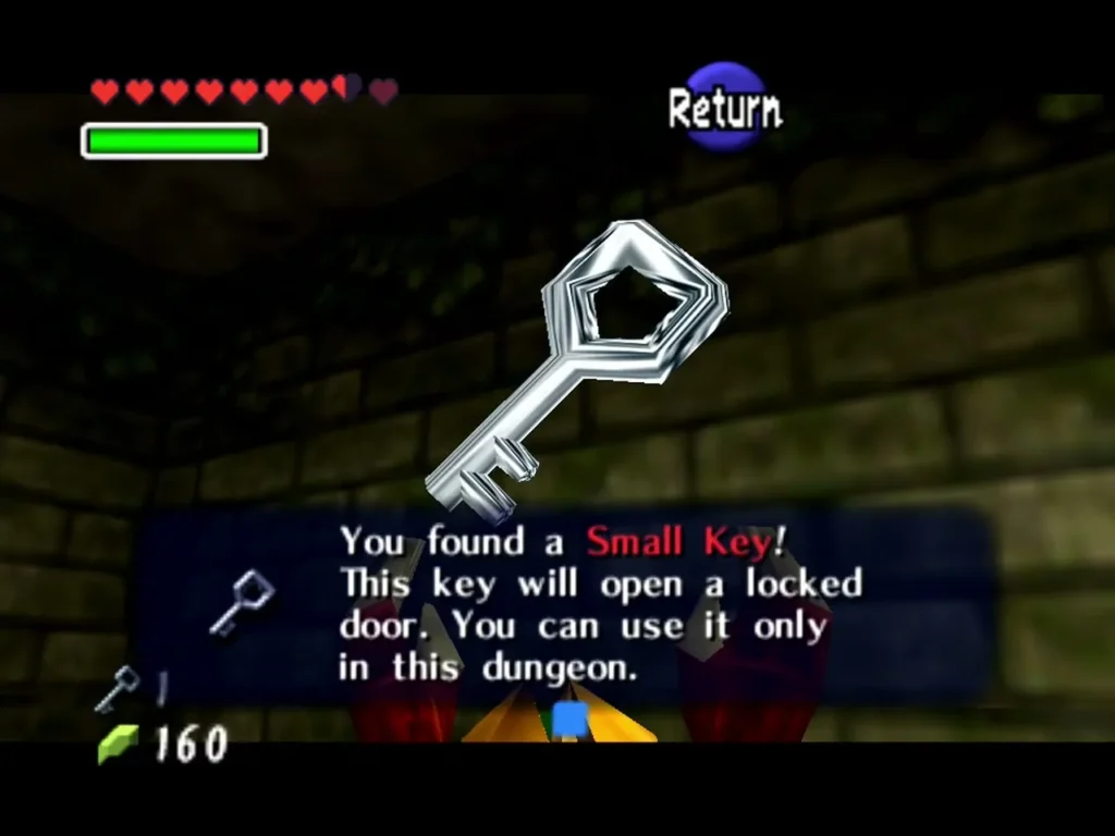 Link holding up a Small Key with the 'You found a Small Key' box shown