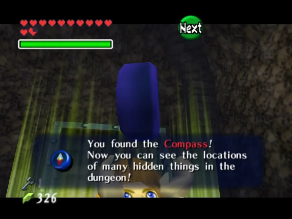 Link holding up the Compass with the You found the Compass message box Link holding up the Compass with the You found the Compass message box