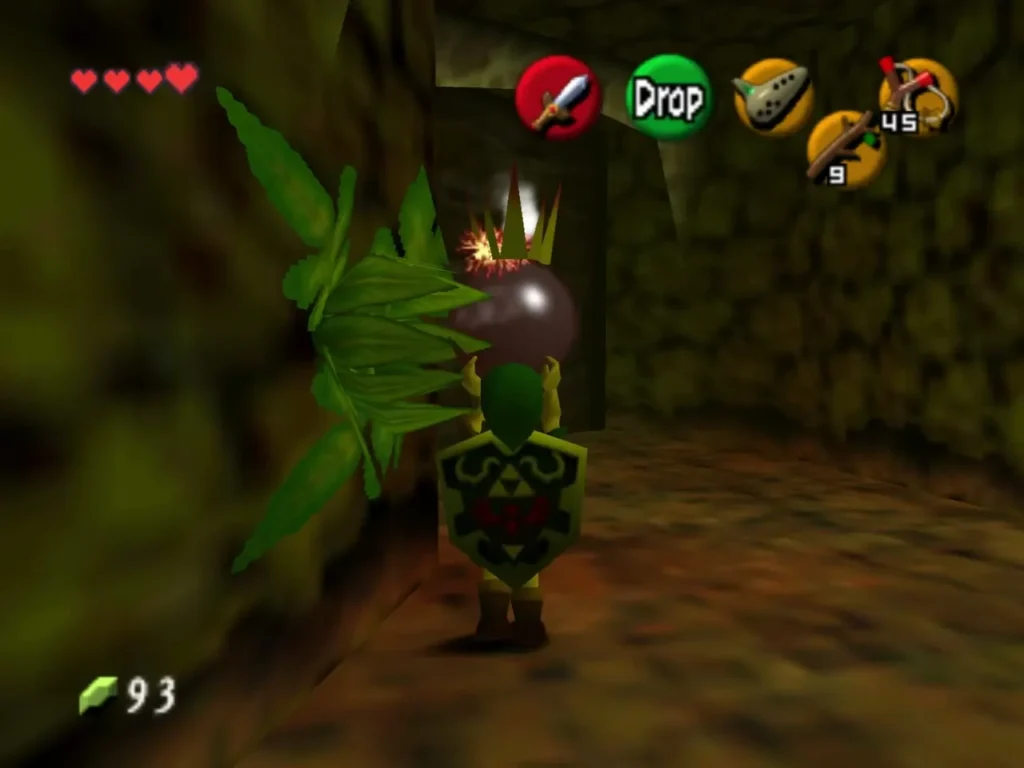 Link holding a lit Bomb Flower beside a leafy plant in the passage